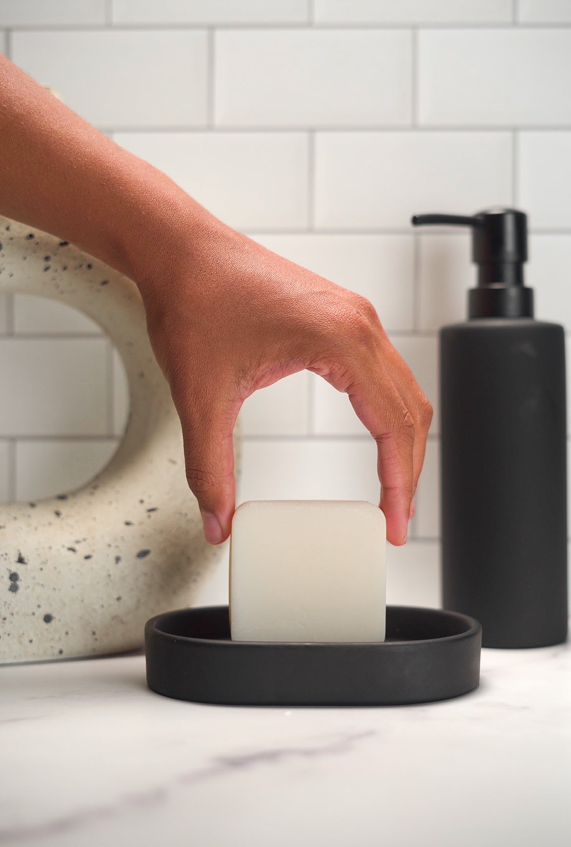 Barebase Lavender Soap on ceramic dish in minimalist bathroom