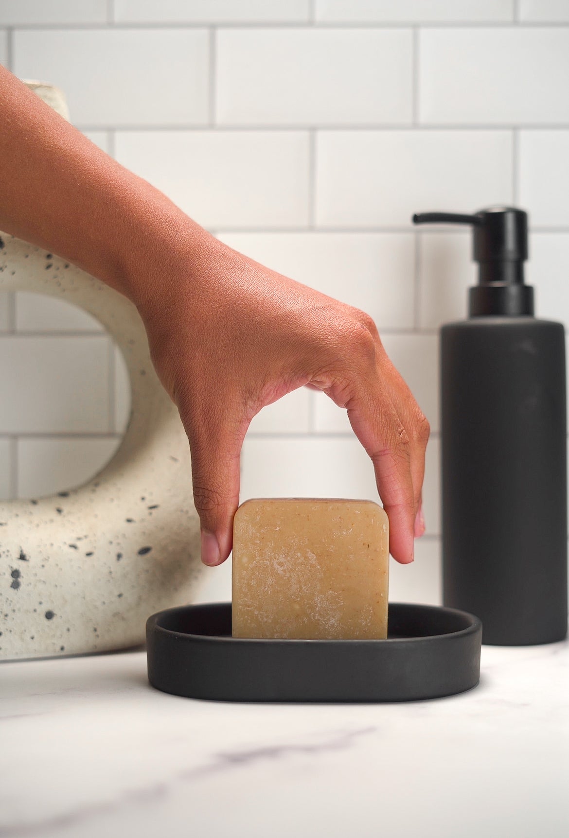 Barebase Goat Milk &Honey Soap on ceramic dish in minimalist bathroom