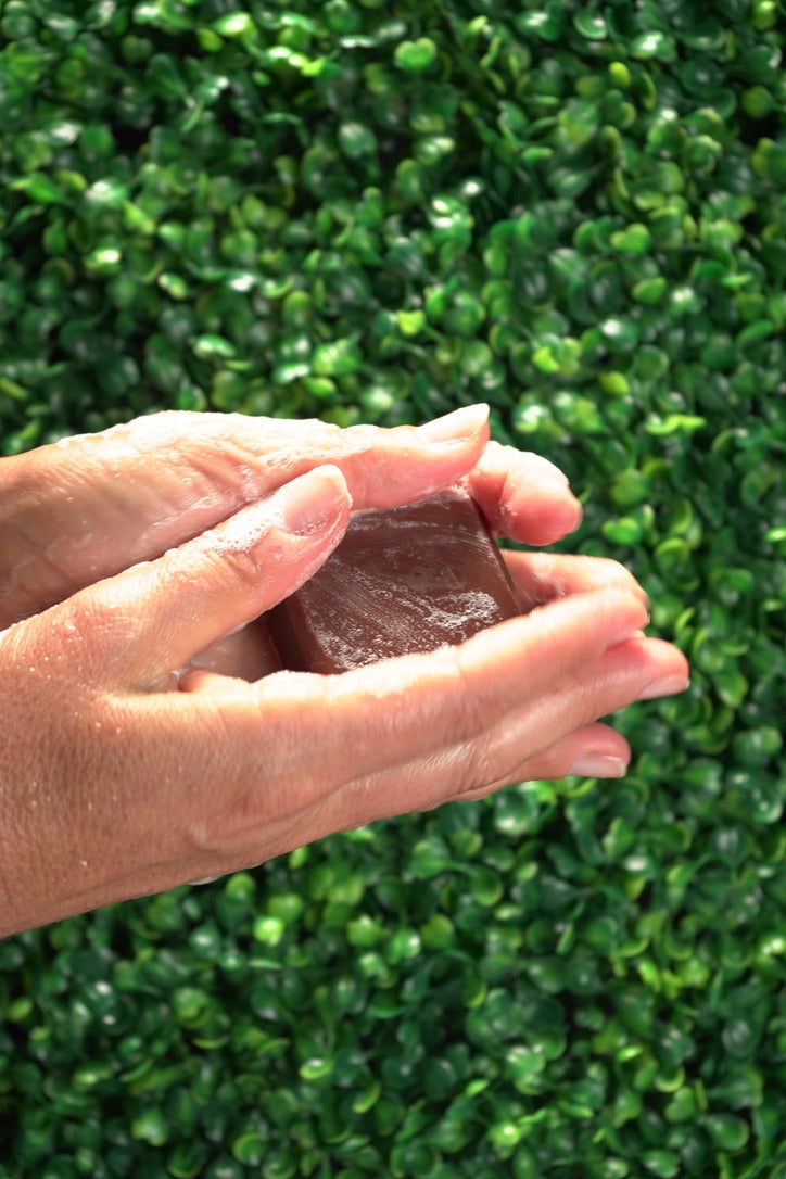 Person washing hands with Barebase Coconut-Free Vanilla Chamomile Soap