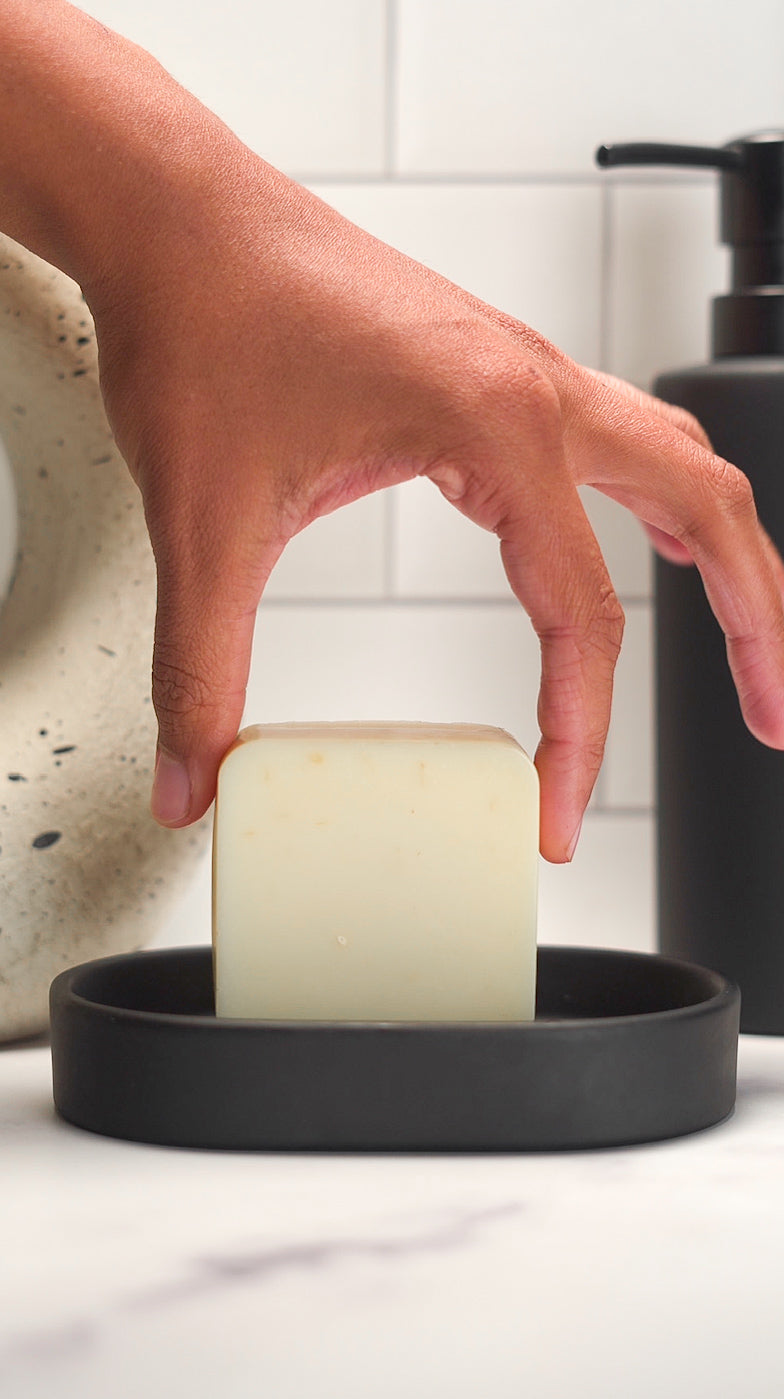 Textured surface of Barebase Fresh Dandelion Soap with natural dandelions